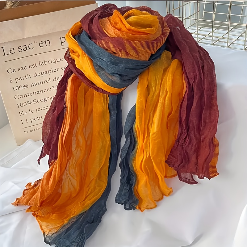 Questo è un foulard dai colori sfumati. La texture del foulard…