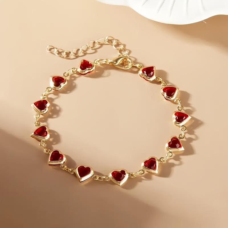 Bracciale da donna dorato elegante e  con ciondolo a cuore…