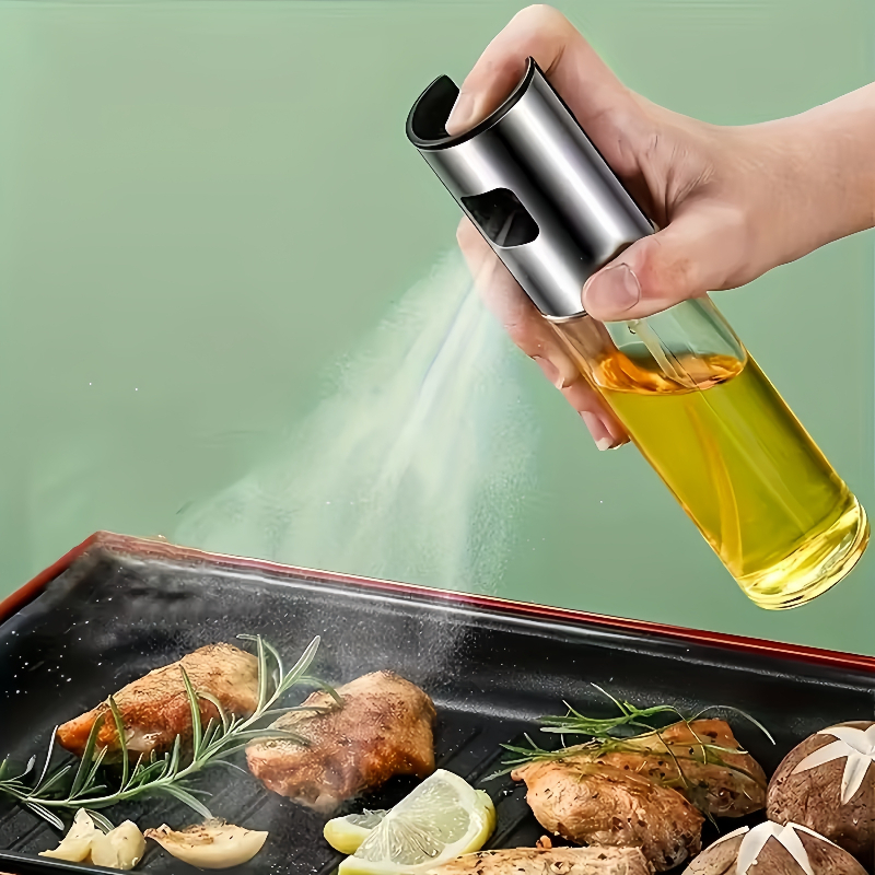 Un flacone spray da 100 ml per olio d'oliva in vetro e acciaio…