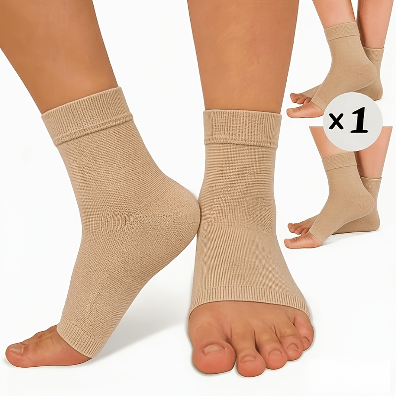 Un paio di calze a compressione aperte sulle dita, unisex, in…